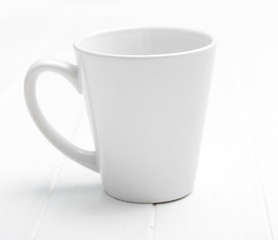 White simple elegant cup for tea without any pictures, original and lovely handle
