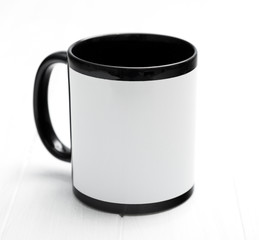 Huge mug sitting on the table, black and white, additional printing space