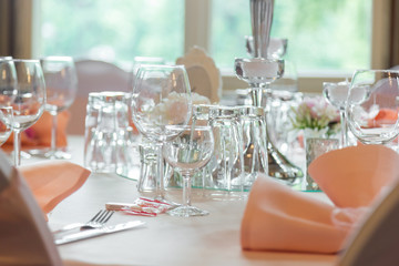 catering table set service with silverware, napkin and glass at restaurant before party