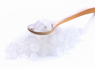 Fototapeta na wymiar Rock sugar in spoon on white background