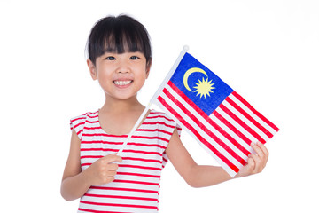 Asian chinese little girl holding Malaysian Flag in isolated white background