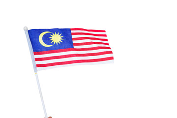 Human hand holding Malaysian Flag