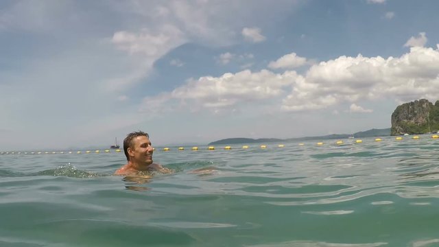 Happy Man Swimming In Sea Water Action Camera POV Of Young Guy On Beautiful Beach During Summer Vacation