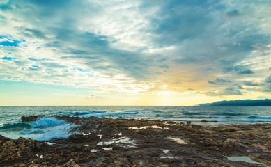 Sunset with clouds and sea waves, Crete, Greece, Europe