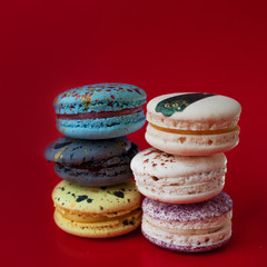 Macarons on red background, Beautiful dessert, six different flavors