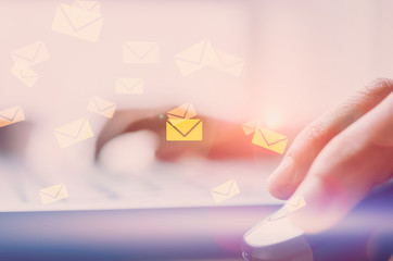 Business economic technology and working connect concept. Close up woman hand using notebook double exposure email fly draw graphic colorful bokeh background.