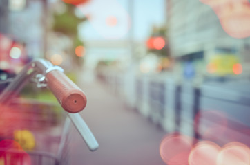 Copy space of blur bicycle parking with colorful bokeh light abstract background.