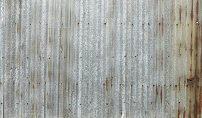 Fototapeta na wymiar Old damage rusty zinc plat wall