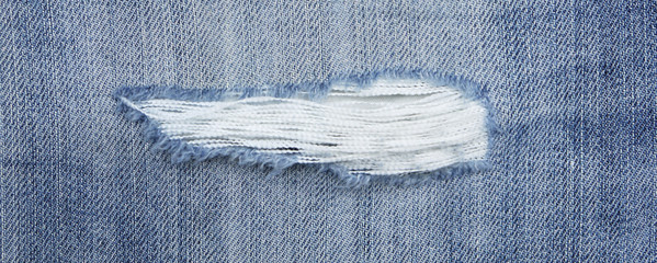 torn old blue jeans background