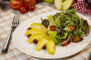 Salad with meat and arugula. Salad with duck meat, baked apple and arugula