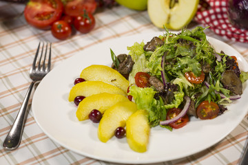 Salad with meat and arugula. Salad with duck meat, baked apple and arugula