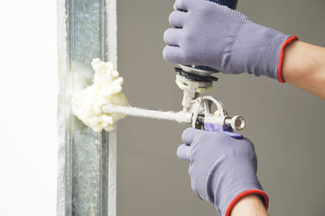 The worker installs the door