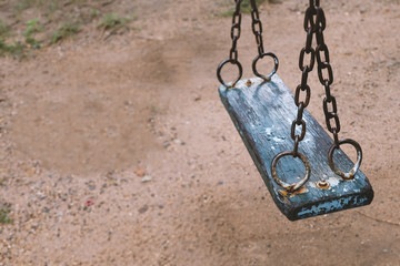 Old swing have rusty on hook ,nobody play long time ago