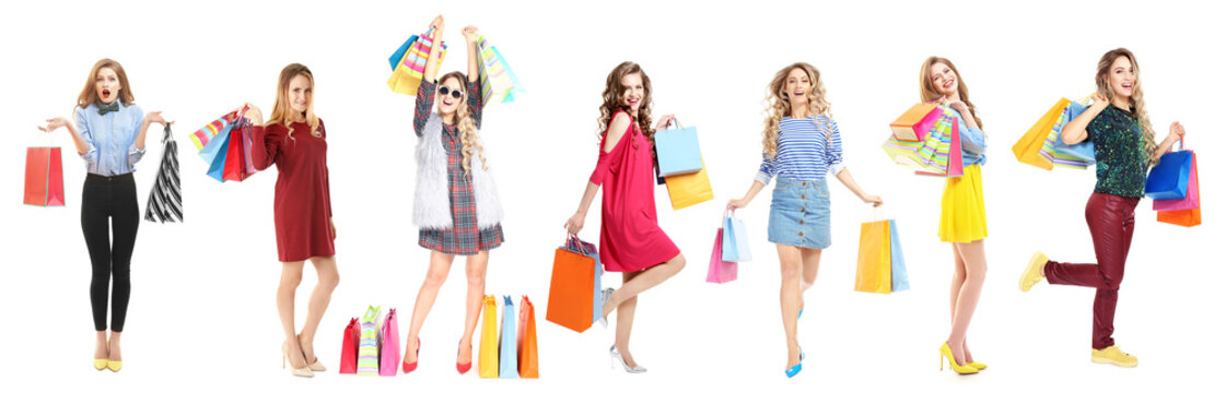 Beautiful women with shopping bags on white background