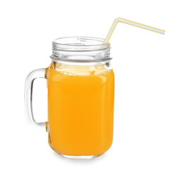 Mason jar of fresh orange juice on white background