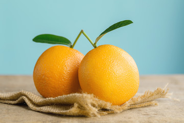 Oranges group freshly on a wooden table. Half of orange on the wooden table. Empty ready for your orange