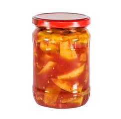 Lecho (ragout from pereets, tomatoes, onions) in a glass jar isolated on white