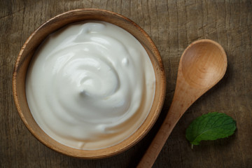 Greek yogurt on wooden background