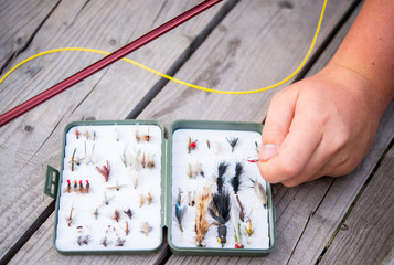 Fly fishing equipment on bench © mooseshop