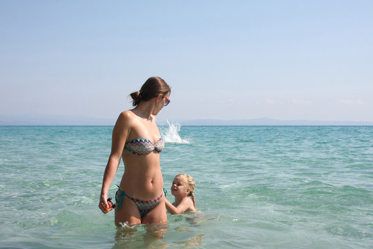 Mother and daughter in the sea