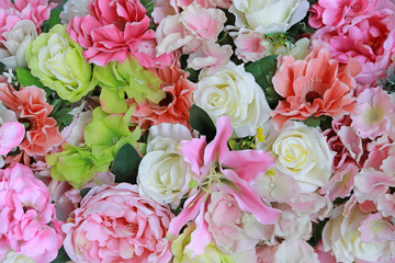 Artificial bouquet flowers background.