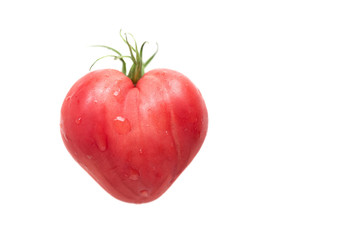 Heart shaped tomato on white background