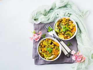 Light summer salad with lettuce, kiwi, peach, chickpea and black sesame seeds, mint.