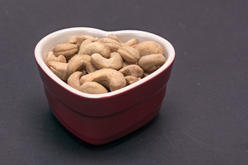 Heart shaped bowl of cashew nuts