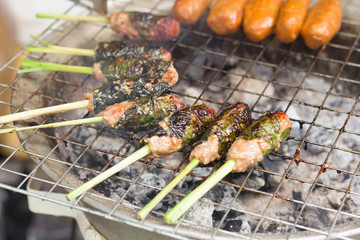 Appetizing pieces of marinated fish ball, on skewers ,Wrapped with lemongrass leaves
