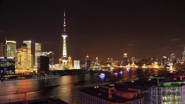 Zoom out timelapse:Shanghai night, China.On the left, Pudong with the Oriental Pearl Tower. On the right, The Bund (Puxi Wai-tan)