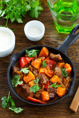 Braised beef with pumpkin in red wine.