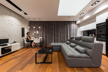 Sophisticated apartment with gray sofa