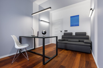 White home office with couch