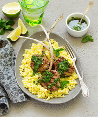 Lamb chops on bone, with mint-garlic sauce and couscous.