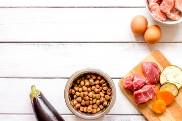 ingredients for pet food holistic top view on wooden background