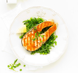 baked fish or roasted fillet or steak with peas,