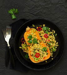 Baked pumpkin stuffed with salad from bulgur.