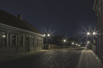 The old-fashioned Latvia.Kuldiga. ventas hub over the bridge at night