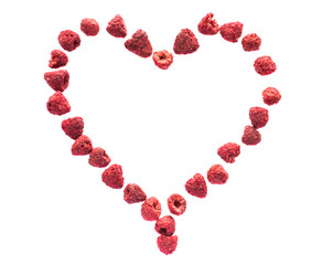 Freeze dried raspberries on a white background in the form of heart. Lyophilization. Food for astronauts.