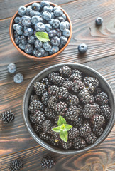 Bowls of blackberries and blueberries
