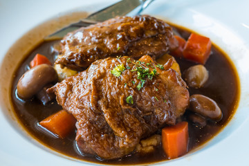 Roasted chicken with ham and mushroom in red wine sauce served with mashed potato