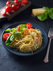 whole grain spaghetti pasta with shrimp, top view, copy space