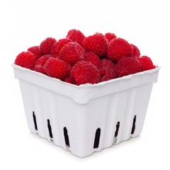 Fresh raspberries in a white paper carton isolated on a white background