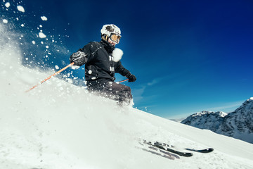 Skier skiing on ski slope