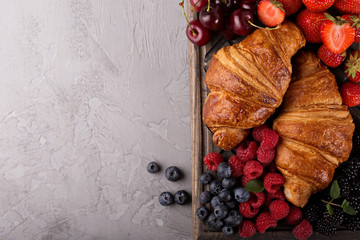 Healthy breakfast with freshly baked croissants and berries
