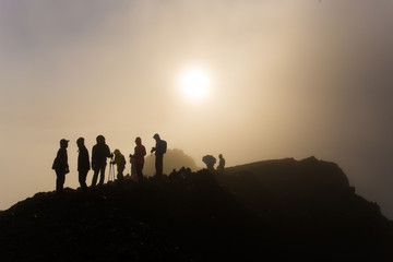 Unidentified mountaineers hike on their way to the peak. The mountain is the second highest volcano in Indonesia and rises to 3726 meters.