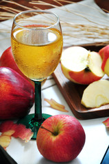 Red Apple Juice with Fresh Apple on Background