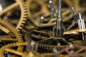 Watch Parts: Collection of Vintage Metallic Watch Gears on a Black Surface