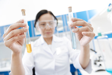 Fototapeta premium Test tubes being filled with chemical reagents