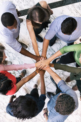 Fototapeta na wymiar Workspace: Team Of Diverse Workers Put Hands Together